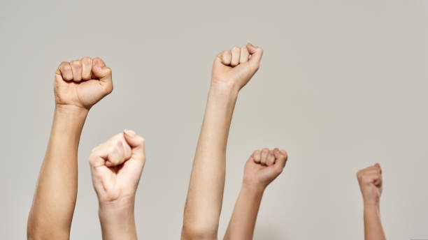 istock Cropped hands with fists during political rally 1436430138
