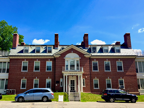 Andover, Massachusetts, USA - June 28, 2019: Isham House is one of the many student dormitories at historic Phillips Academy, an elite college preparatory school in New England.