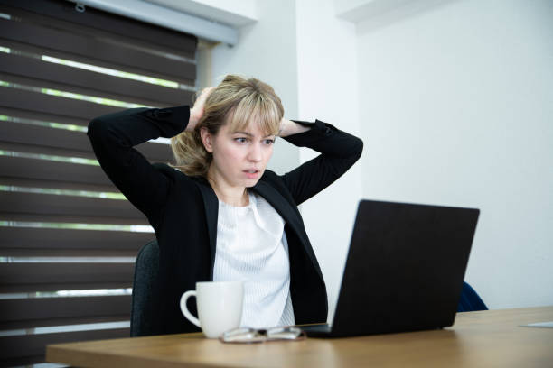 istock An office worker lady stressed at the desk 1436431445