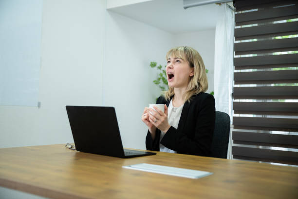 istock An office worker lady tired at the desk 1436433178