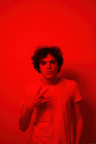 istock Teenage boy showing gesture and looking away 1436433766