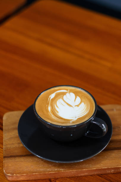 istock hot latte art coffee on wood table, relax time 1436437267