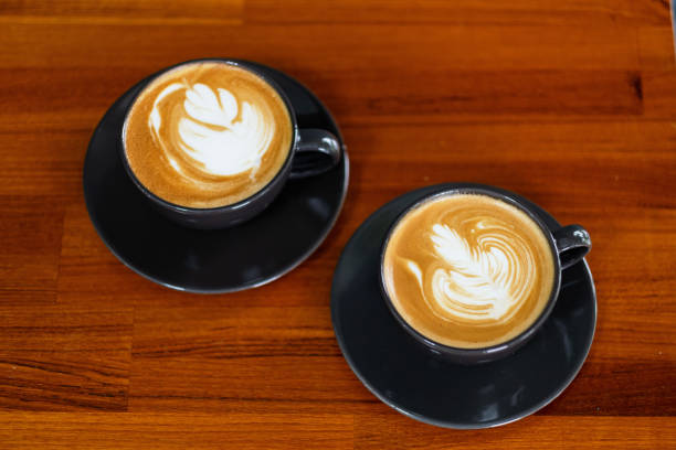 istock hot latte art coffee on wood table, relax time 1436437268