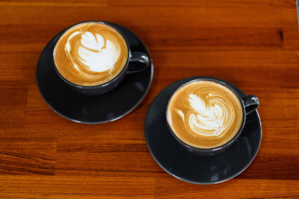 istock hot latte art coffee on wood table, relax time 1436438207