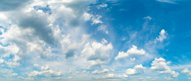 istock Background with high blue sky and white clouds. Summer sky with cumulus clouds. 1436440129