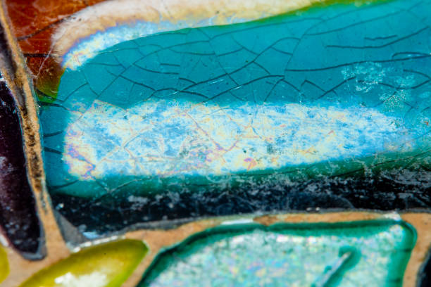 istock Close-up of a surface covered with old glazed paint in soft focus at high magnification. Hand-painted vintage things with small cracks. 1436440183