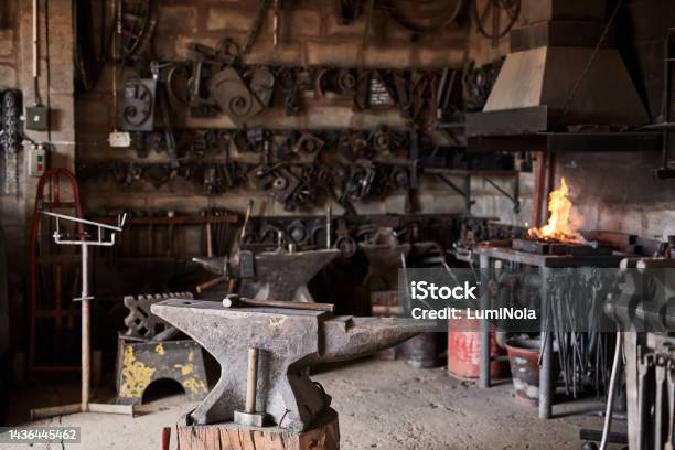 Welding Workshop Fire And Tools In An Industrial Warehouse With Tools And Equipment For Steel Manufacturing Workplace Welder Metal And Anvil In A Mechanical Blacksmith Or Engineering Garage Stock Photo - Download Image Now