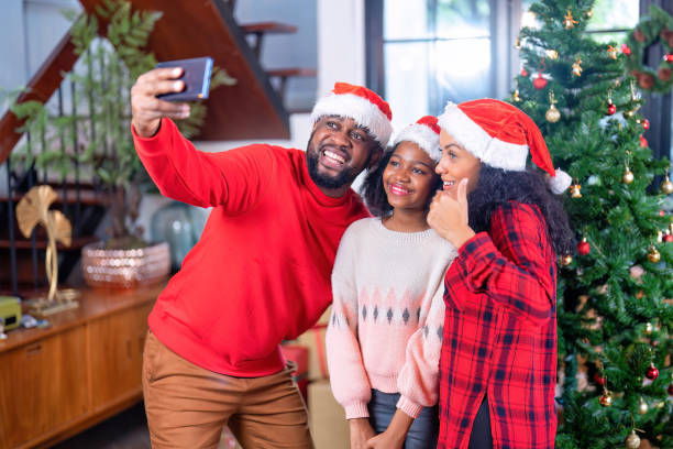 istock Group family gathering sitting on sofa decoration gift box 1436447621