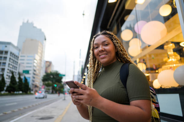 istock Businesswoman using email on the street 1436447886