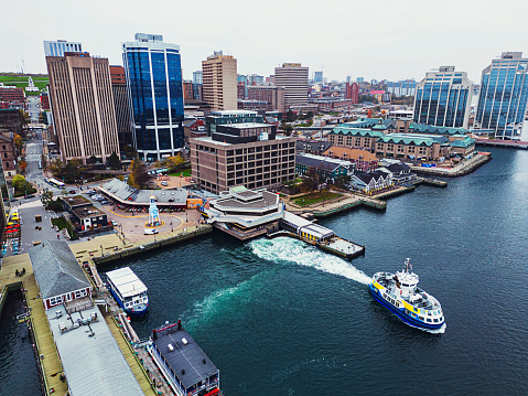 Aerial drone view of the Halifax downtown/waterfront with a departing ferry.