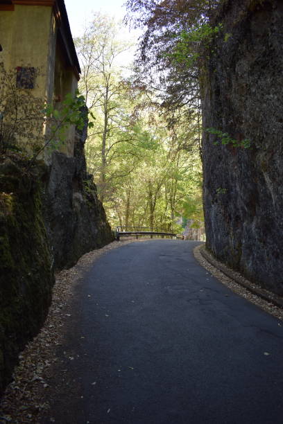 istock narrow road with a chapel 1436449338