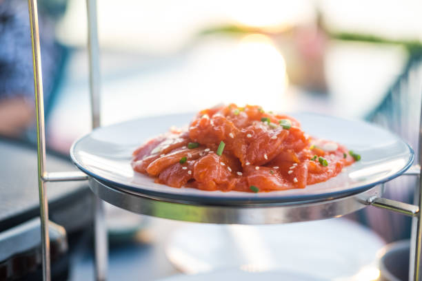 Thai style traditional cuisine raw pork or chicken marinated with spices and sprinkle with white sesame