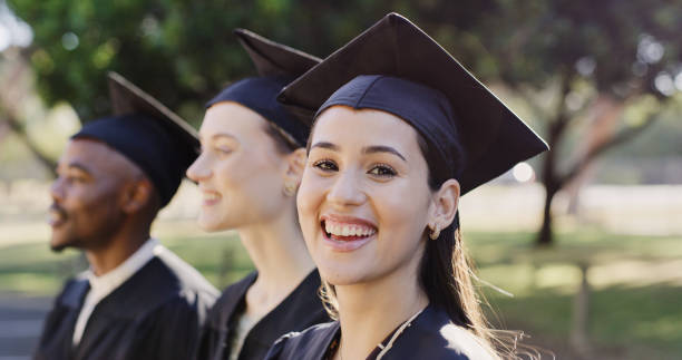 Graduation, education and university portrait of student at graduate ceremony for success in college, school or phd study. Achievement, learning progress or young gen z woman happy graduating academy stock photo