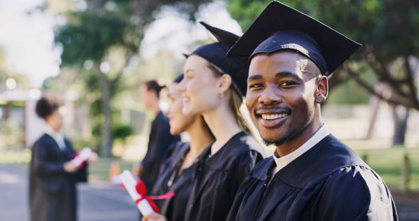 Portrait university student, black man and graduation celebration, event and achievement of goals, education success and motivation. Happy, excited and smile african college graduate celebrate future stock photo