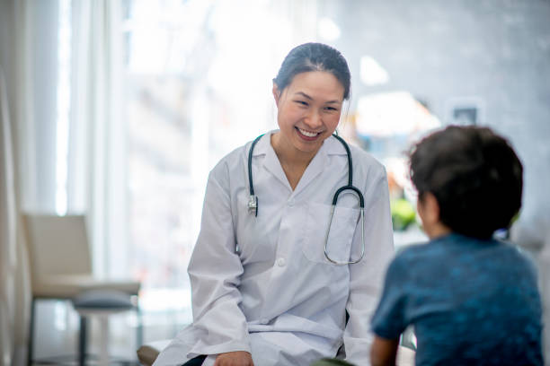 istock Little Boy Talking with a Female Doctor 1436453845