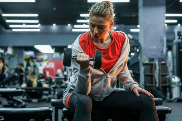 istock Young female working out at the gym. 1436455195