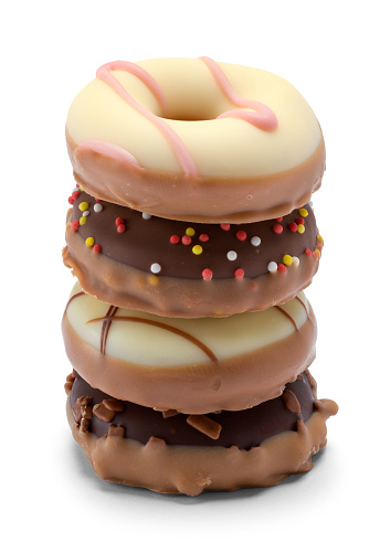 Chocolate Candy Doughnuts Stack Cut Out on White.