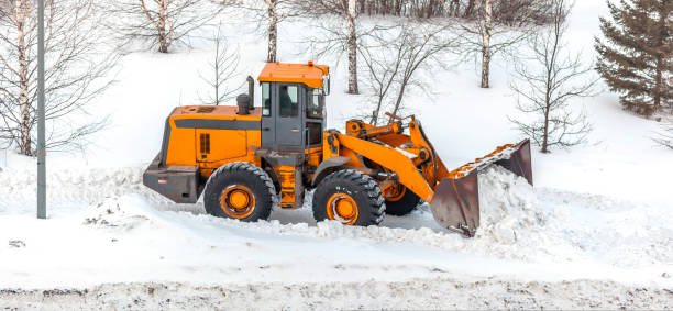istock Snow clearing. Tractor clears the way after heavy snowfall. 1436460938