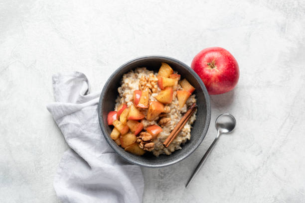 istock Breakfast oatmeal with apple cinnamon and walnuts 1436461028