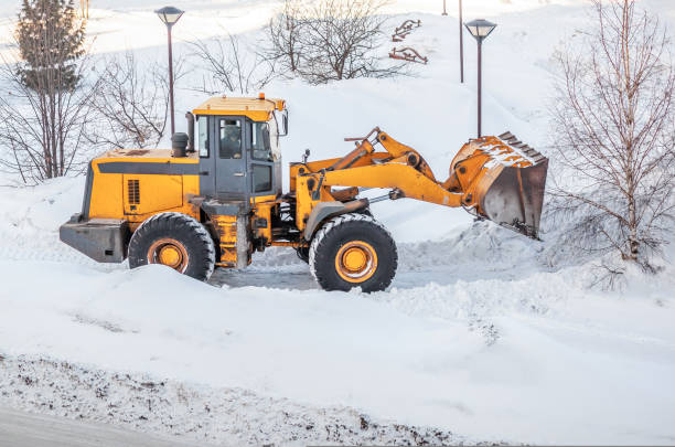 istock Snow clearing. Tractor clears the way after heavy snowfall. 1436461043