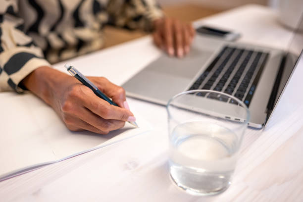 istock Close-up of businesswoman's hands during work on computer 1436463157