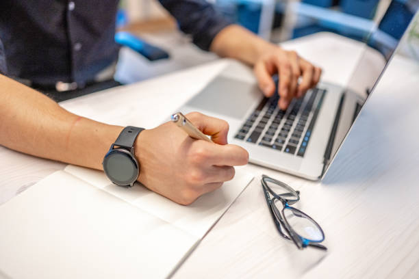 istock Close-up of businessman's hands during work on computer 1436463177
