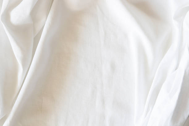 istock White crumpled linen fabric texture background. Natural linen organic eco textiles canvas background. Top view 1436463467
