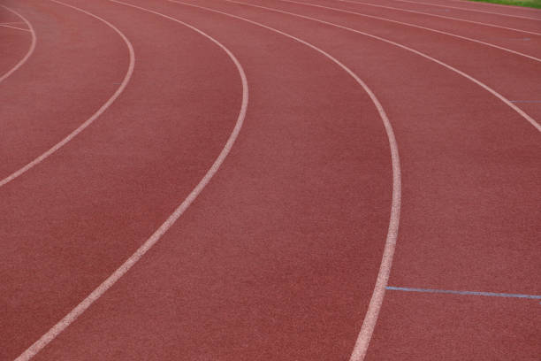 istock White lines on a curve on an athletics track 1436465177