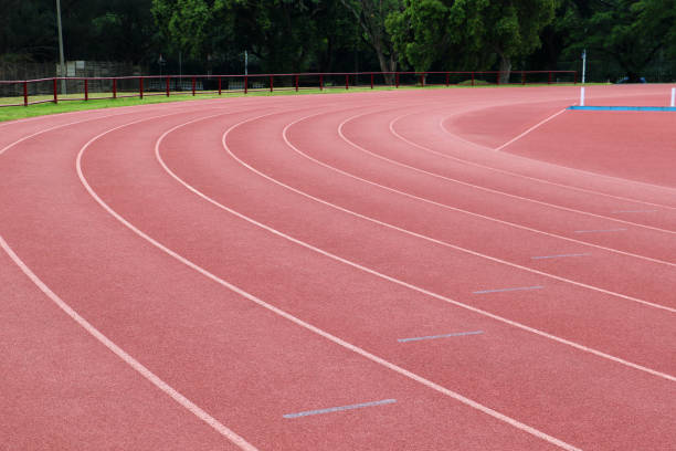 istock White lines on a curve on an athletics track 1436465350