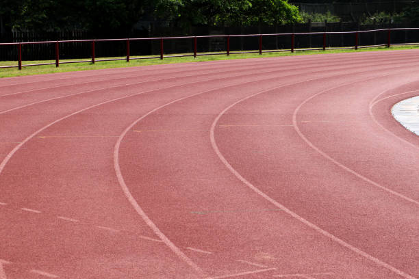 istock White lines on a curve on an athletics track 1436465352