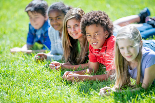 istock Children Laying in the Grass Portrait 1436465482