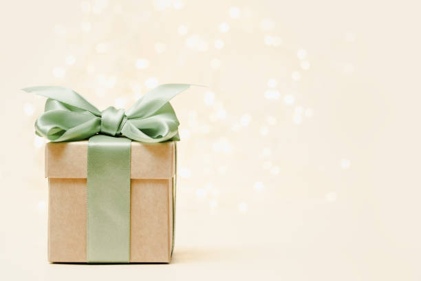 istock Gift box with bow and christmas lights background 1436469711
