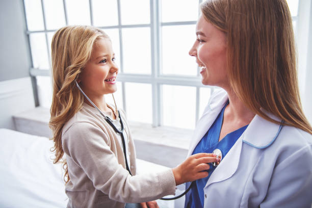 istock Little girl and pediatrician 1436469943