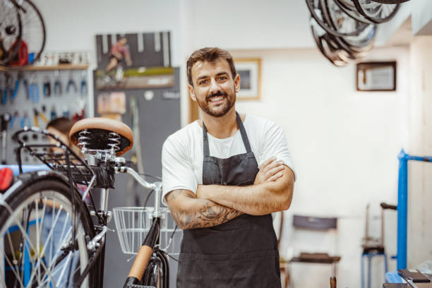 istock Male Bicycle Mechanic Looking at Camera 1436470207