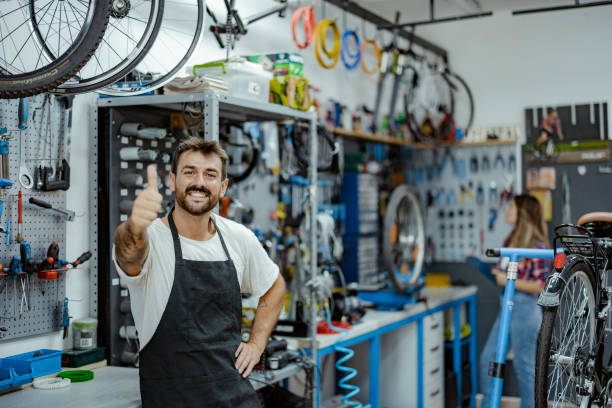 istock Bicycle Mechanic Looking at Camera with Thumb Up 1436470692