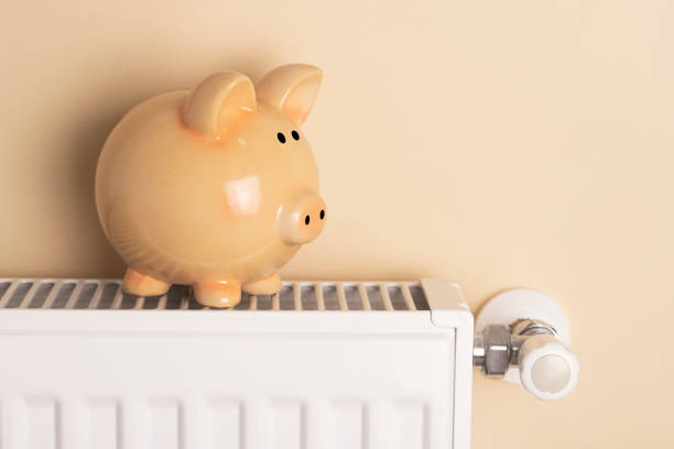 istock Piggy bank  sit on a radiator 1436471070