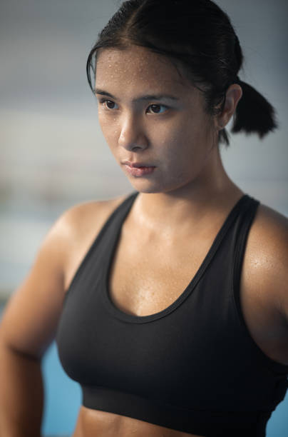istock Young Asian Female MMA Fighter Posing 1436471884
