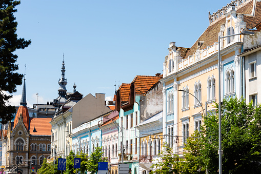 Colorful buildings of an historic town avenue in Europe. Vintage urban design for small suburb