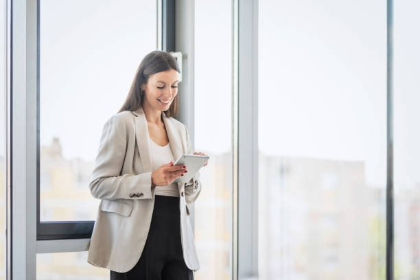 istock Confident businesswoman using digital tablet at the office 1436474044