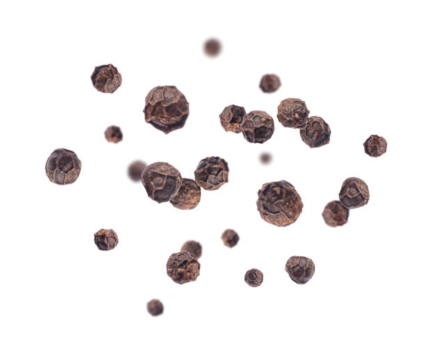 istock Pepper seeds in a random position in the air on a white background 1436474174