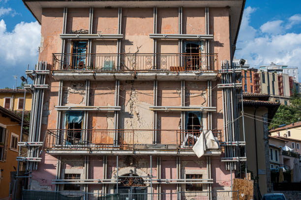 L'Aquila, Italy - 07-07-2022: Buildings damaged by the 2009 earthquake still supported many years later