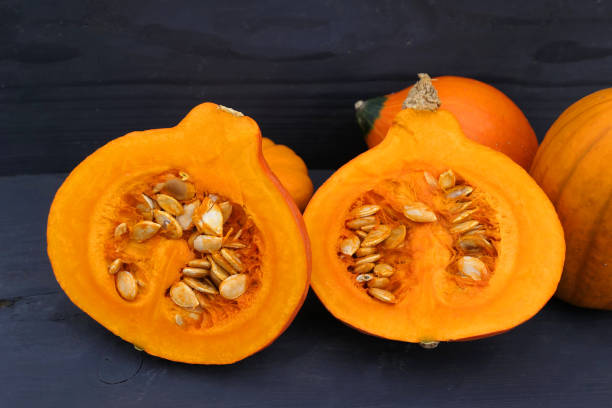 istock Pumpkins in the kitchen. Cut orange Hokkaido pumpkin. 1436477007