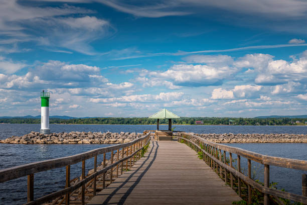 pier and a lighthouse at Ottawa River in Pembroke in Canada stock photo