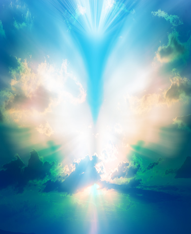 Abstract angel shape with bright wings with the sky in the background