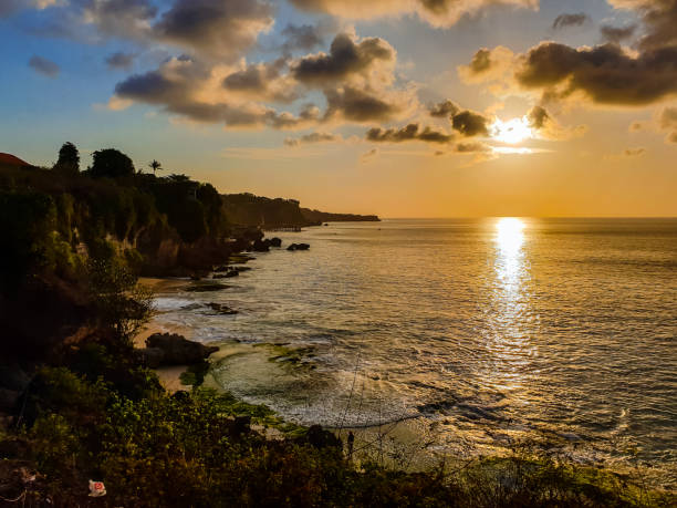 istock Beautiful Bali indian ocean coast with cliff at sunset 1436484146