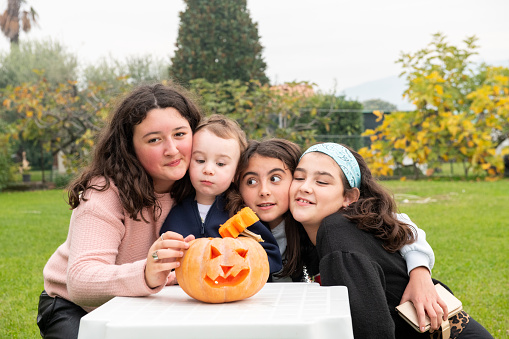 Halloween. Happy children in front of Jack o' Lantern waiting for halloween.