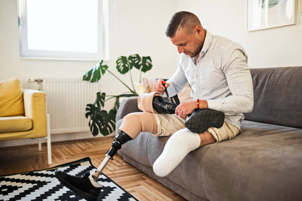 istock Young man repairing prosthetic leg 1436489352
