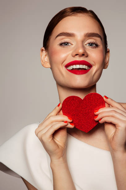 istock Beautiful emotional woman holding present box 1436489904