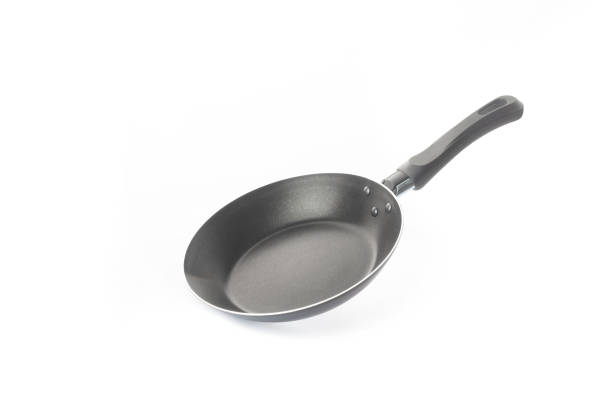 istock A frying pan floats in the air on a white background 1436490565