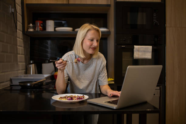 istock Young woman preparing meal 1436492168